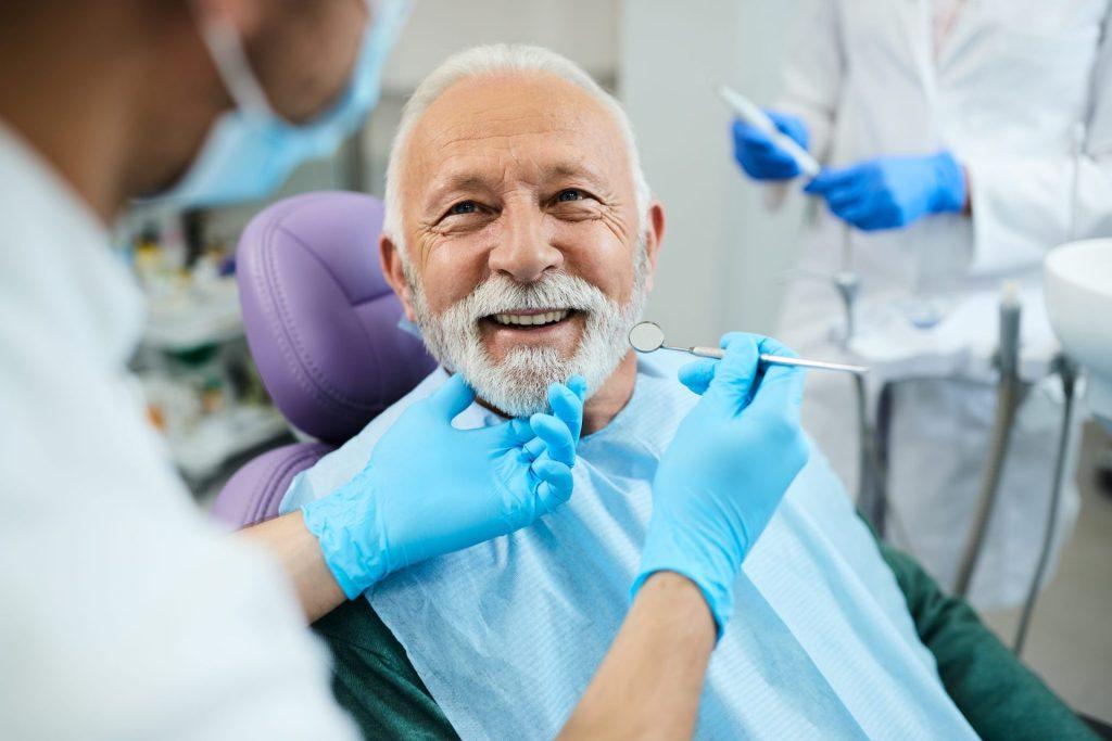 Smiling senior man during a dental check-up