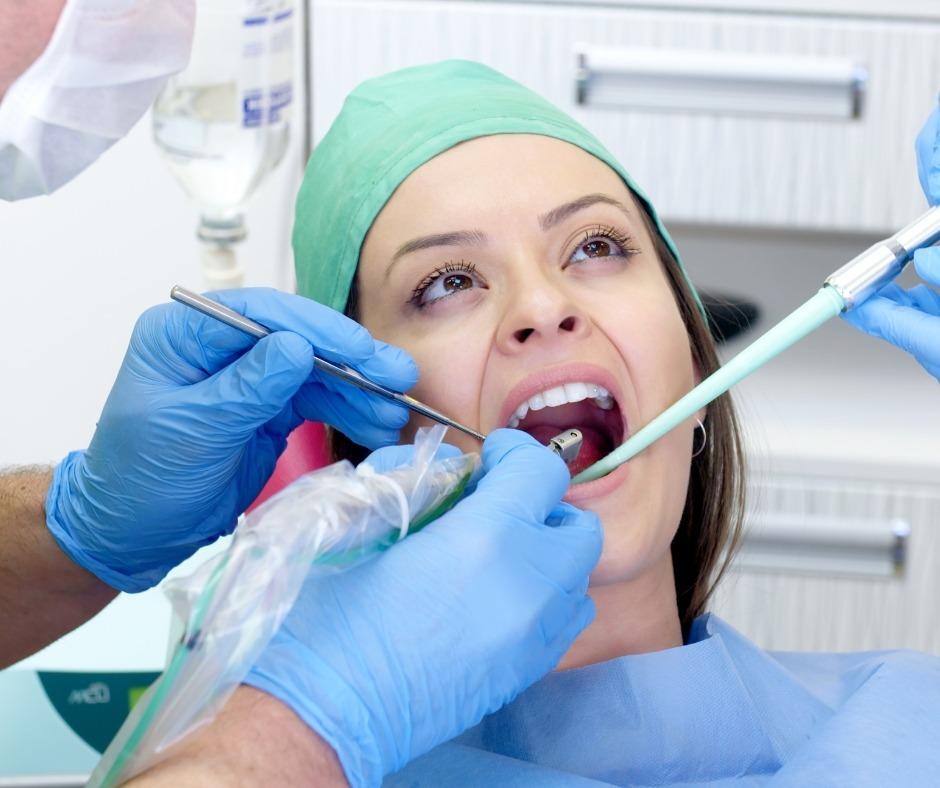 Dentist and assistant working on a patient's teeth